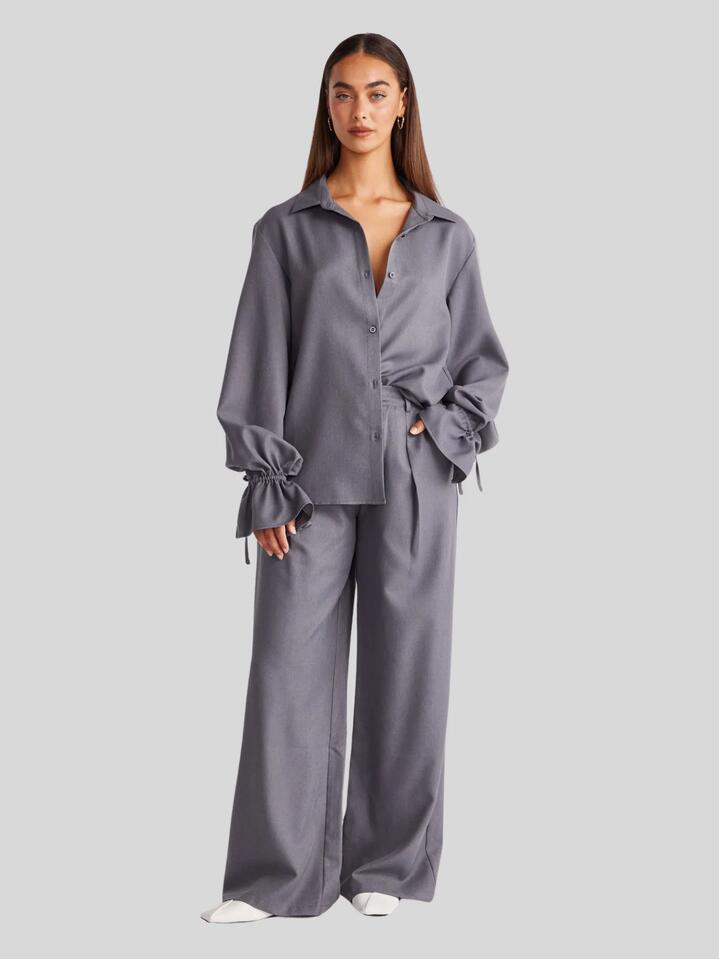 Image of a model wearing Pants. Productname: SNDYS Woods Pants in Charcoal colour by brand - SNDYS
