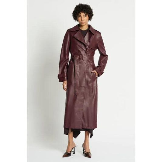 Image of a model wearing Outerwear. Productname: Plot Point Leather Trench in Dark Cherry colour by brand - sass and bide