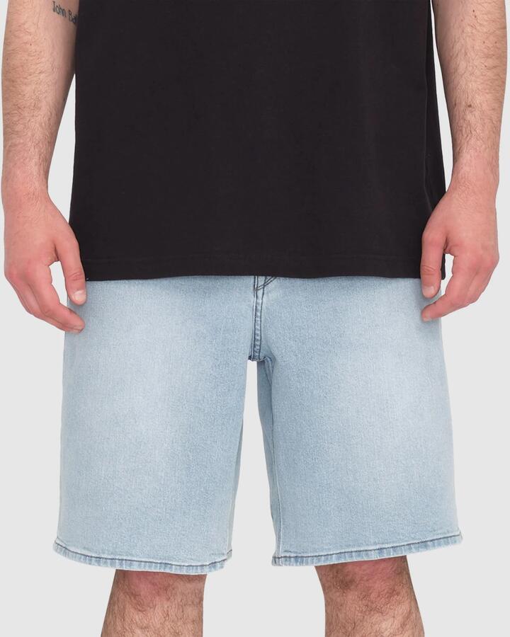 Image of a model wearing Shorts. Product name - Volcom Mens Billow Denim Shorts Desert Blue in Desert Blue colour by brand - Volcom