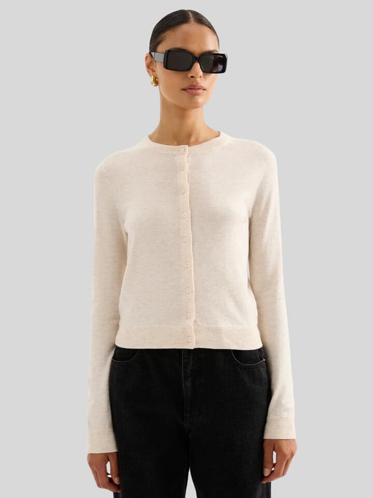 Image of a model wearing Outerwear. Productname: Nude Lucy Rae Knit Cardigan in Cream Marle colour by brand - Nude Lucy