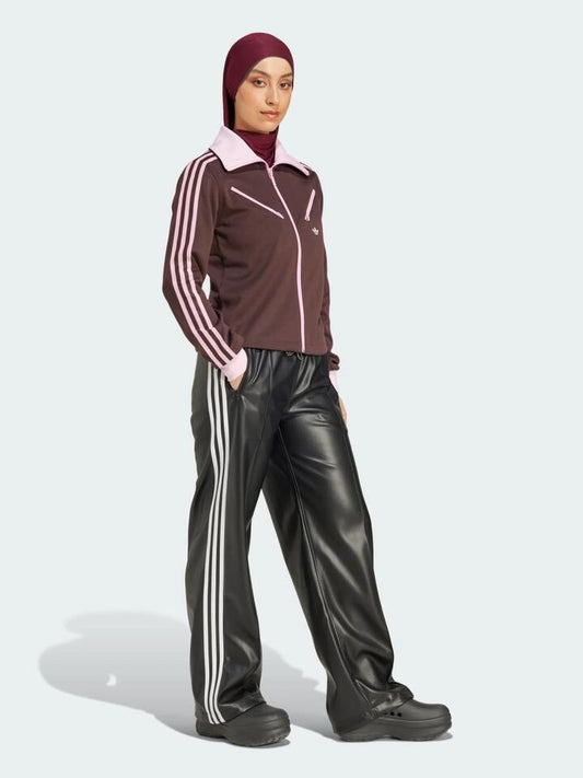 Image of a model wearing Tops. Productname: Adidas Adicolour 70S Montreal Track Top in Shadow Brown colour by brand - Adidas