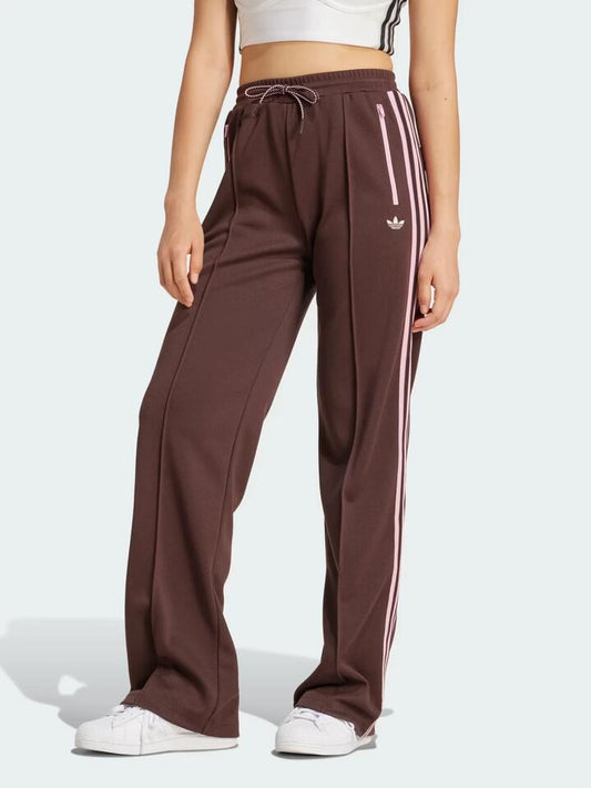 Image of a model wearing Denim. Productname: Adidas Adicolour 70S Montreal Track Bottom in Shadow Brown colour by brand - Adidas