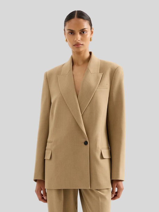 Image of a model wearing Outerwear. Productname: Nude Lucy Mercer Blazer in Caramel colour by brand - Nude Lucy