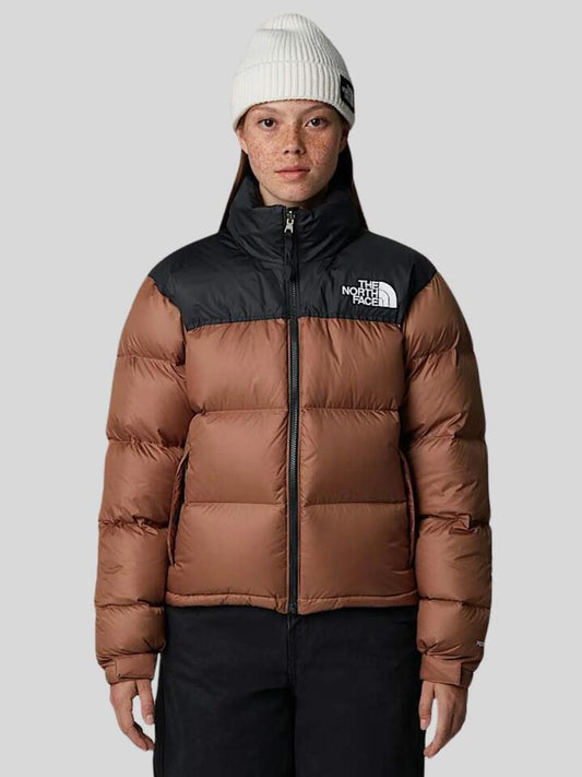 Image of a model wearing Outerwear. Productname: The North Face 1996 Retro Nuptse Jacket in Latte/TNF Black colour by brand - The North Face