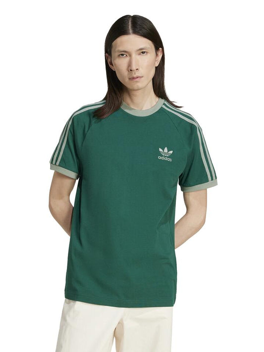 Image of a model wearing Tops. Productname: Adidas Adicolor Poly Tee in COLLEGIATE GREEN colour by brand - Adidas