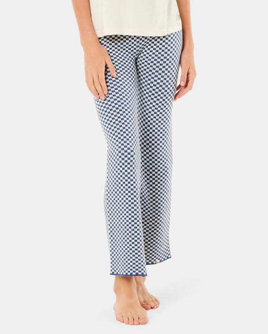 Image of a model wearing Pants. Product name - Rip Curl Girls 8-14 Neon Isles Knit Pants Navy in Navy colour by brand - Rip Curl