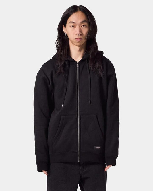 Image of a model wearing Outerwear. Productname: Former Mens Recurrent Zip Up Hoodie Black - in Black colour by brand - Former