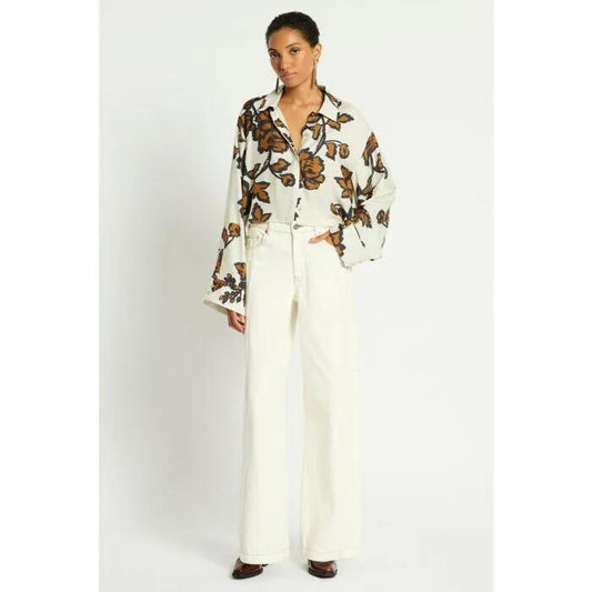 Image of a model wearing Denim. Productname: Quick Thinker Wide Leg Jean in White colour by brand - sass and bide