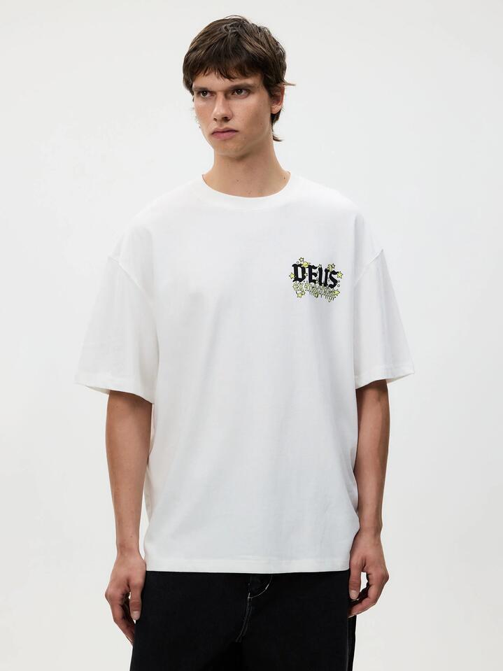 Image of a model wearing Tops. Productname: Deus Cool World Tee in Vintage White colour by brand - Deus