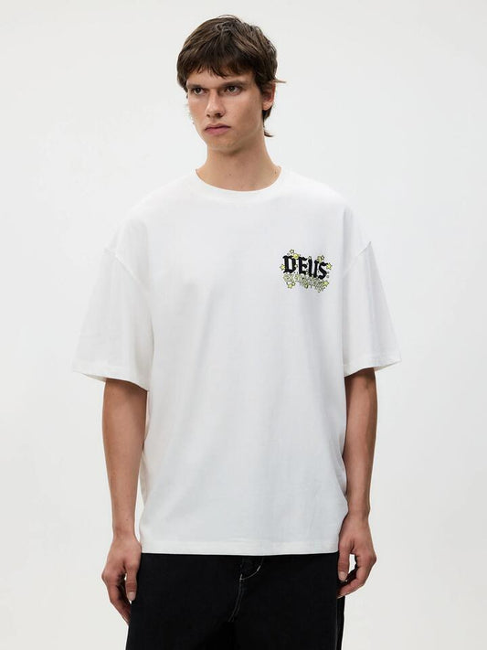 Image of a model wearing Tops. Productname: Deus Cool World Tee in Vintage White colour by brand - Deus