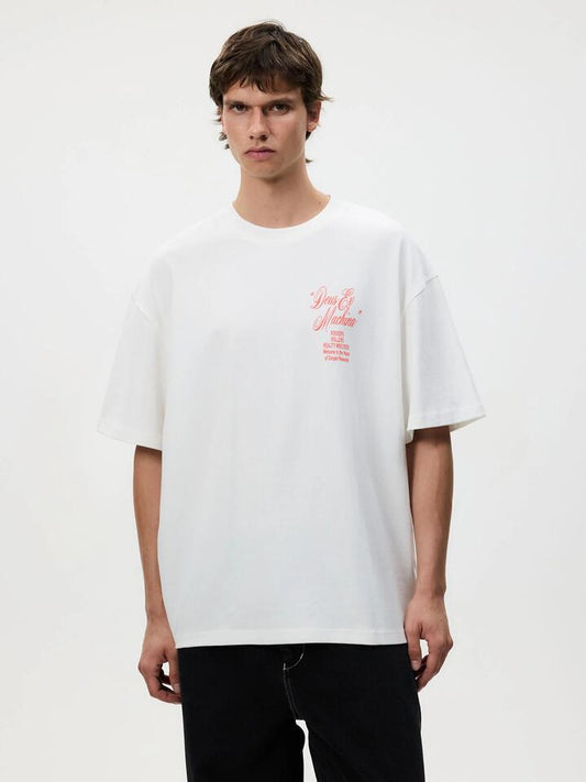 Image of a model wearing Tops. Productname: Deus Complaint Tee in Vintage White colour by brand - Deus