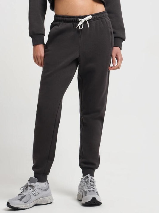 Image of a model wearing Pants. Productname: Nude Lucy Carter Classic Trackpants in Coal colour by brand - Nude Lucy