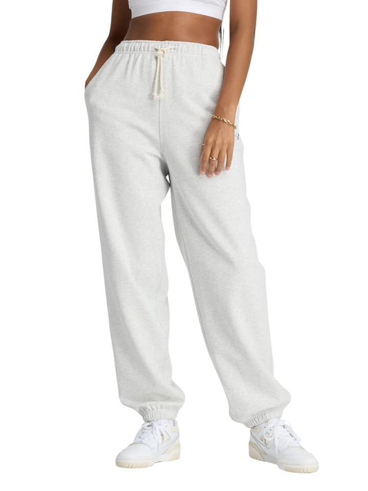 Image of a model wearing Pants. Productname: New Balance Athletics French Terry Jogger in Ash Heather colour by brand - New Balance