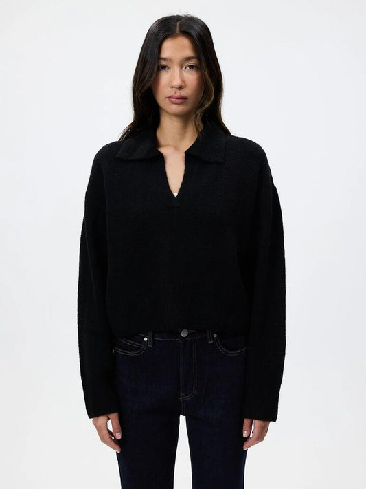 Image of a model wearing Tops. Productname: Lulu & Rose Isa Rugby Knit in Black colour by brand - Lulu & Rose