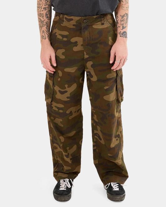 Image of a model wearing Pants. Productname: Worship - Mens Stealth Cargo Pants - Green - in Green colour by brand - Worship
