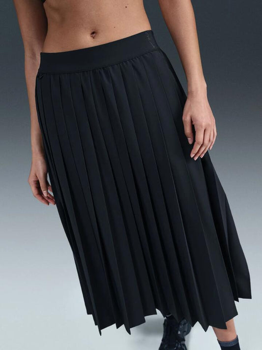 Image of a model wearing Skirts. Productname: Nike Women's Nike 24.7 Pleated Skirt in Black/Dk Smoke Grey colour by brand - Nike