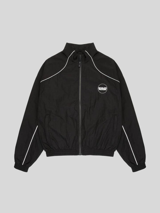 Image of a model wearing Tops. Productname: Boiler Room Shell Track Top in BLACK colour by brand - Boiler Room