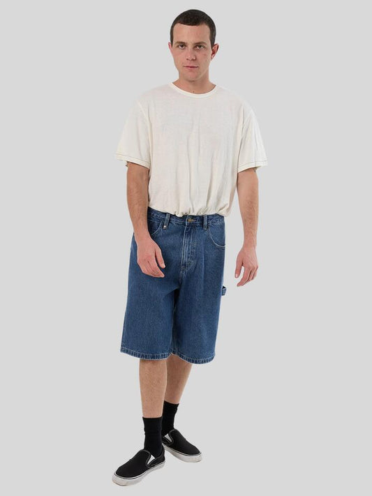 Image of a model wearing Denim. Productname: Thrills Big Slacker Denim Short in VINTAGE RINSE BLUE colour by brand - Thrills