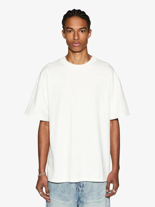 Image of a model wearing Tops. Productname: Ksubi Sott Ekcess SS Tee in VINTAGE WHITE colour by brand - Ksubi