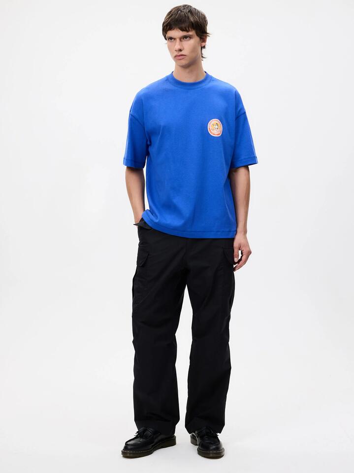 Image of a model wearing Tops. Productname: Article One Supreme Tee in Cobalt colour by brand - Article One