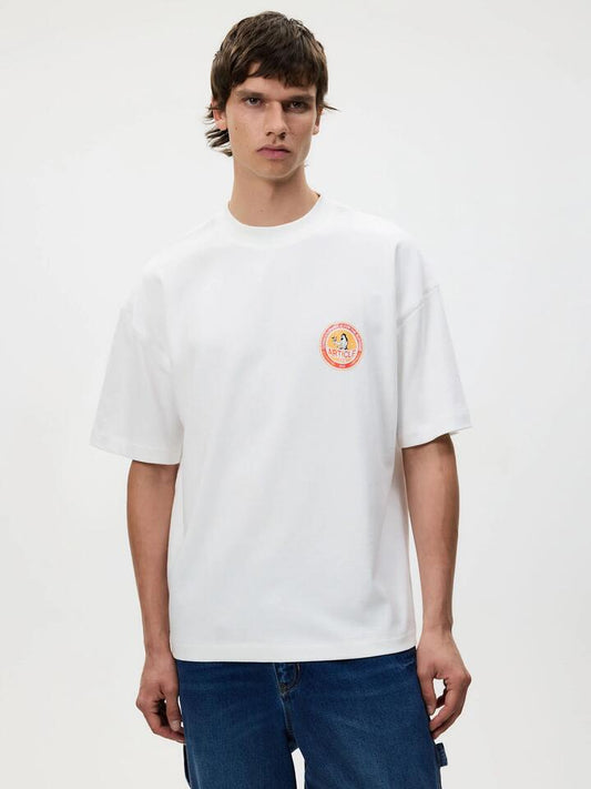 Image of a model wearing Tops. Productname: Article One Supreme Tee in White colour by brand - Article One
