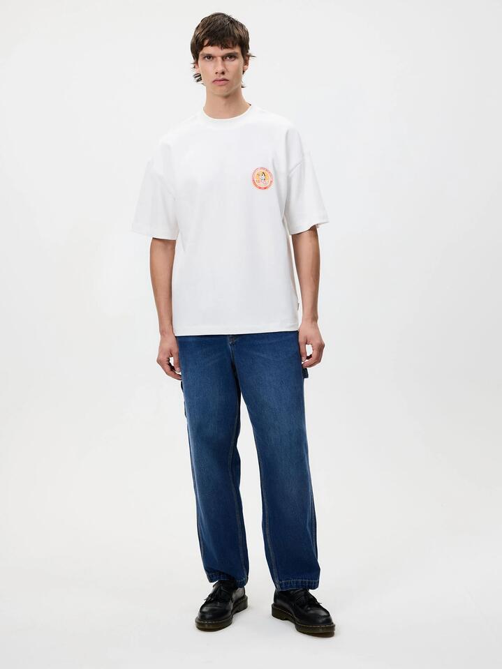 Image of a model wearing Tops. Productname: Article One Supreme Tee in White colour by brand - Article One