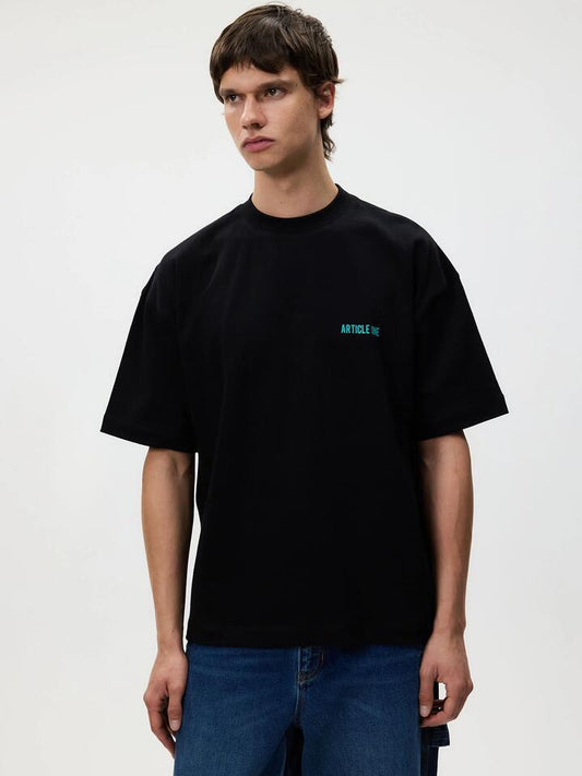 Image of a model wearing Tops. Productname: Article One City Lights Tee in Black colour by brand - Article One