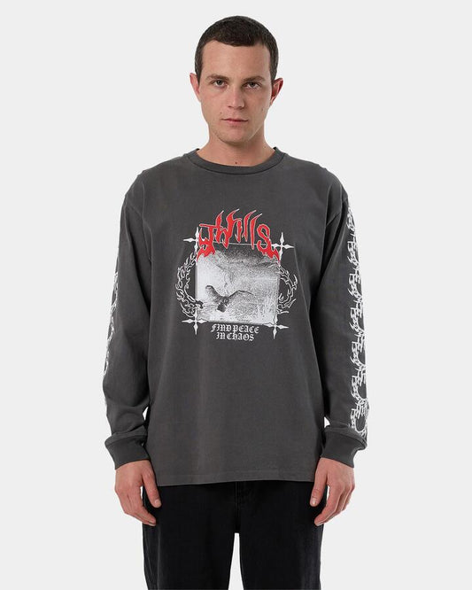 Image of a model wearing Tops. Product name - Thrills Mens Peaceful Chaos Oversize Long Sleeve T-Shirt Merch Black in Merch Black colour by brand - Thrills