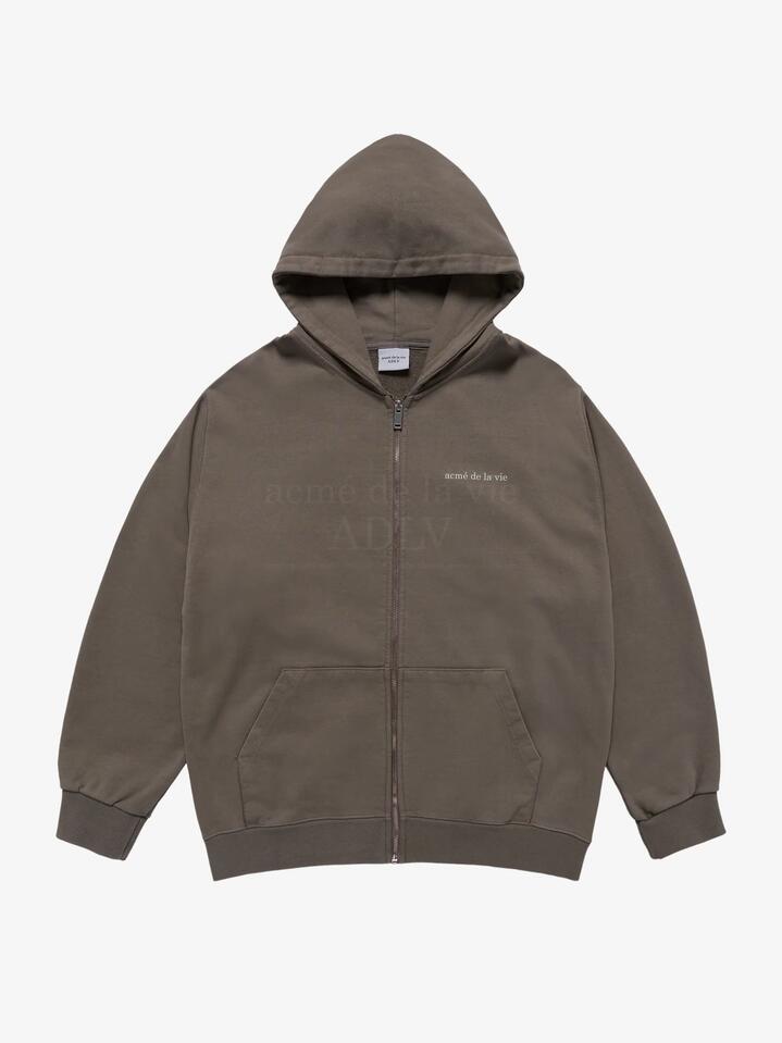 Image of a model wearing Outerwear. Productname: ADLV Basic Bio Washing Hoodie Zip Up in COCOA colour by brand - ADLV