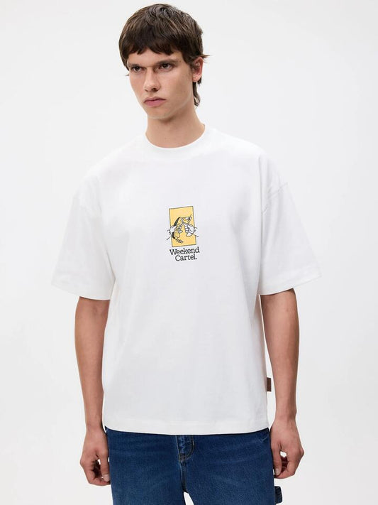 Image of a model wearing Tops. Productname: Weekend Cartel Business Tee in Off White colour by brand - Weekend Cartel