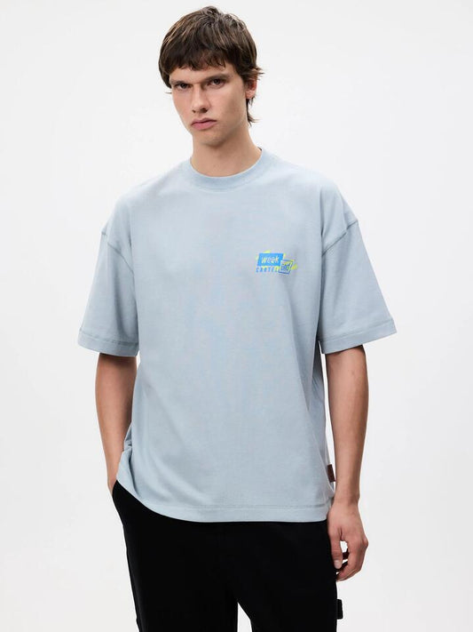 Image of a model wearing Tops. Productname: Weekend Cartel 9 to 5 Tee in Mist colour by brand - Weekend Cartel