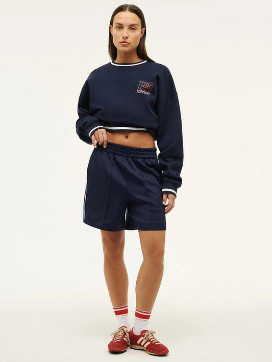 Image of a model wearing Shorts. Productname: Pe Nation Man Down Track Short in Dark Navy colour by brand - Pe Nation