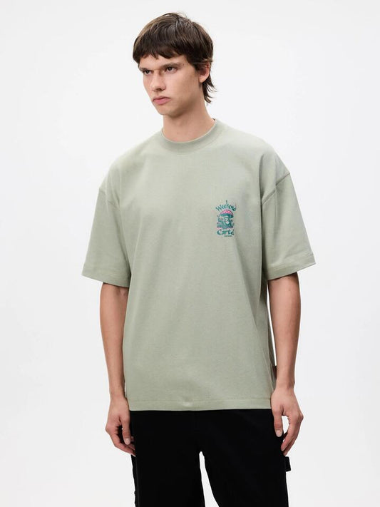 Image of a model wearing Tops. Productname: Weekend Cartel Getaway Tee in Mint colour by brand - Weekend Cartel