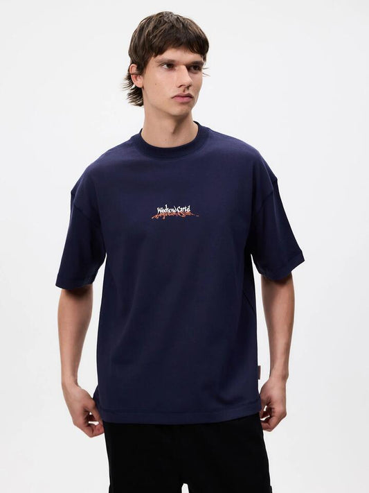 Image of a model wearing Tops. Productname: Weekend Cartel Mushroom Tee in Blue colour by brand - Weekend Cartel