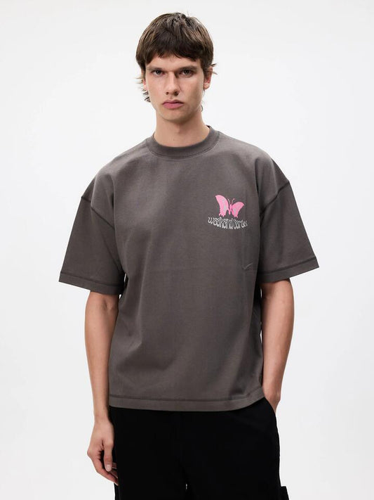 Image of a model wearing Tops. Productname: Weekend Cartel Weekend Trip Tee in Obsidian colour by brand - Weekend Cartel