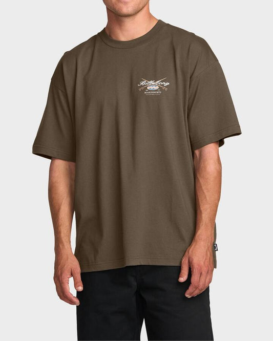 Image of a model wearing Tops. Productname: Billabong - Mens Crossboards T-Shirt - Brown - in Brown colour by brand - Billabong
