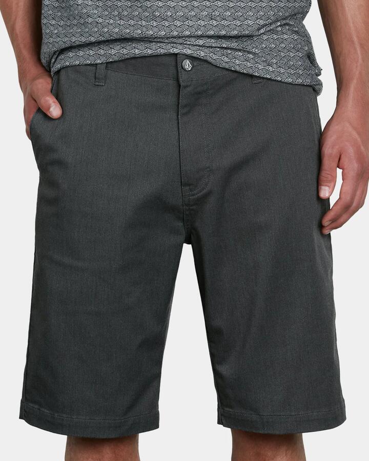 Image of a model wearing Shorts. Product name - Volcom Mens V Monty Stretch Chino Shorts Charcoal Heather in Charcoal Heather colour by brand - Volcom