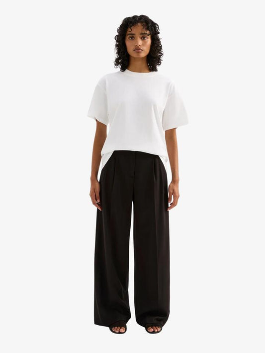 Image of a model wearing Pants. Productname: Nude Lucy Rana Pant in Black colour by brand - Nude Lucy