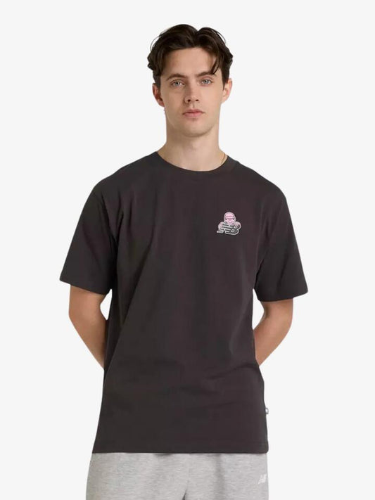 Image of a model wearing Tops. Productname: New Balance NB X Face Oka Sport T-Shirt in Black colour by brand - New Balance