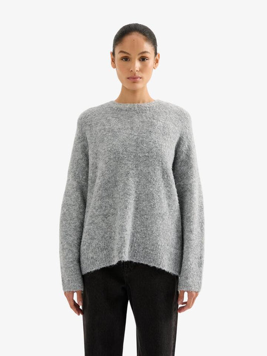 Image of a model wearing Tops. Productname: Nude Lucy Elias Knit in Charcoal colour by brand - Nude Lucy