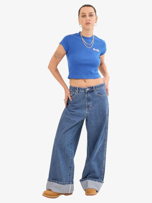 Image of a model wearing Denim. Productname: Worship Mammoth Turn Up Jean in STEADY MID BLUE colour by brand - Worship