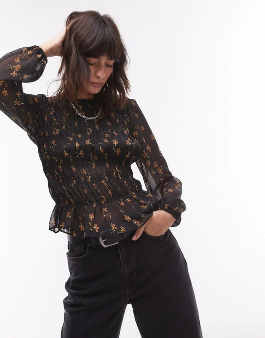 Image of a model wearing Tops. Productname: Topshop Shirred Top in Black Ditsy in Black colour by brand - Topshop