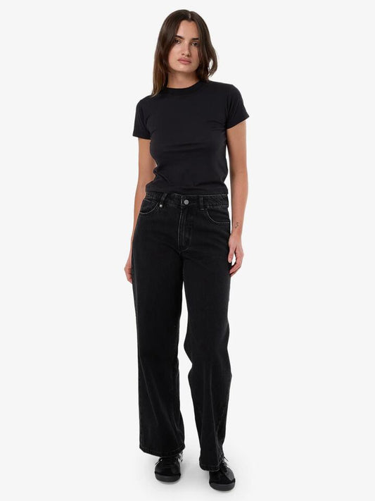 Image of a model wearing Denim. Productname: Thrills Billie Low Jean in Aged Black colour by brand - Thrills