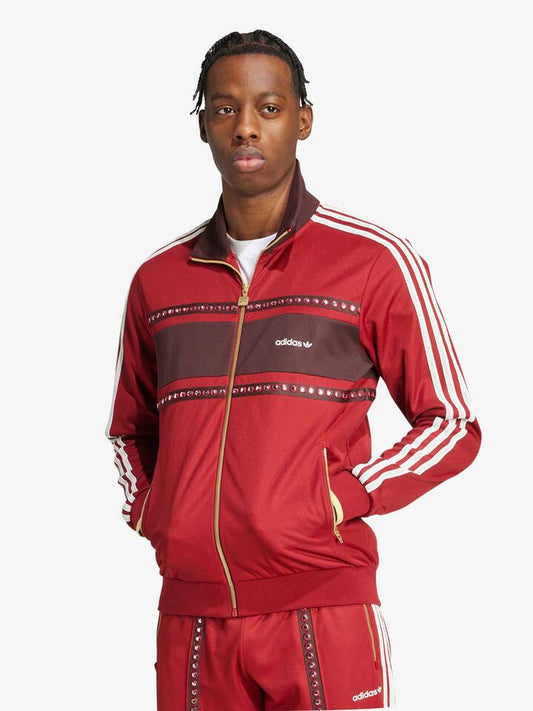 Image of a model wearing Tops. Productname: Adidas Track Top in rust red colour by brand - Adidas