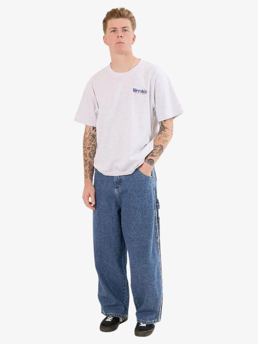 Image of a model wearing Denim. Productname: Worship Striker Dozer Jean in Steady Mid Blue colour by brand - Worship