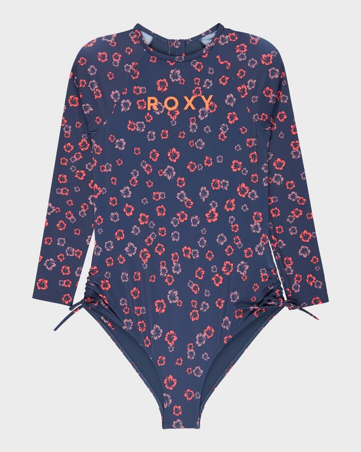 Image of a model wearing Tops. Product name - Roxy Girls 8-16 Cute Ditsy Long Sleeve Onesie Rash Vest Oceana She S Cute Ditsy in Oceana She S Cute Ditsy colour by brand - Roxy