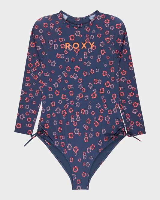 Image of a model wearing Tops. Productname: Roxy Girls 8-16 Cute Ditsy Long Sleeve Onesie Rash Vest Oceana She S Cute Ditsy - in Oceana She S Cute Ditsy colour by brand - Roxy