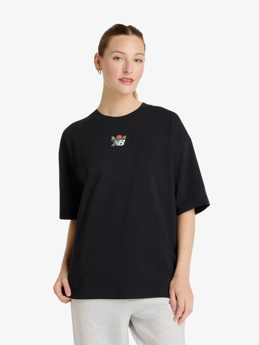Image of a model wearing Tops. Productname: New Balance Athletics Flower Oversized Tee in Black colour by brand - New Balance