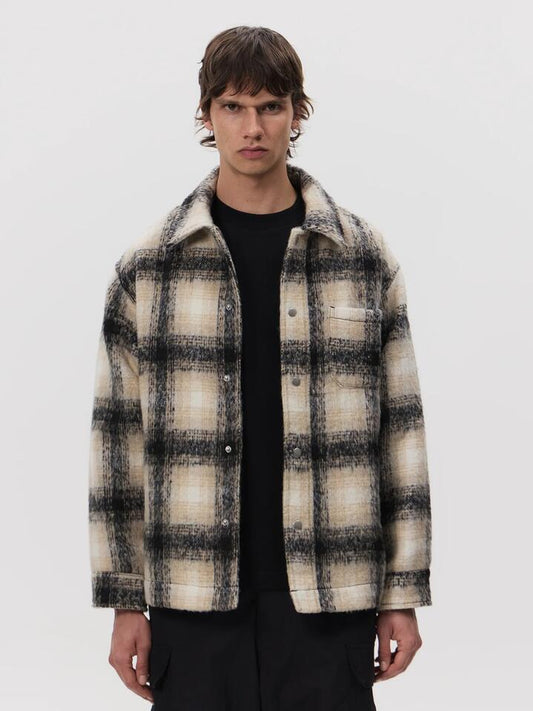 Image of a model wearing Outerwear. Productname: Article One Tech Flannel Jacket in Black/White Check colour by brand - Article One