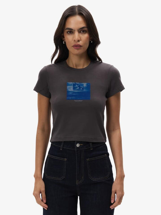 Image of a model wearing Tops. Productname: Thrills Future Leap Mini Tee in MERCH BLACK colour by brand - Thrills